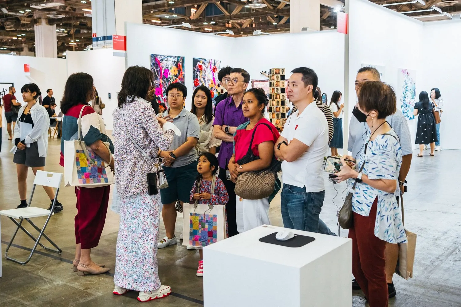 Visitors gathered around Shavonne Wong's Meet Eva Here installation at ART SG 2025.