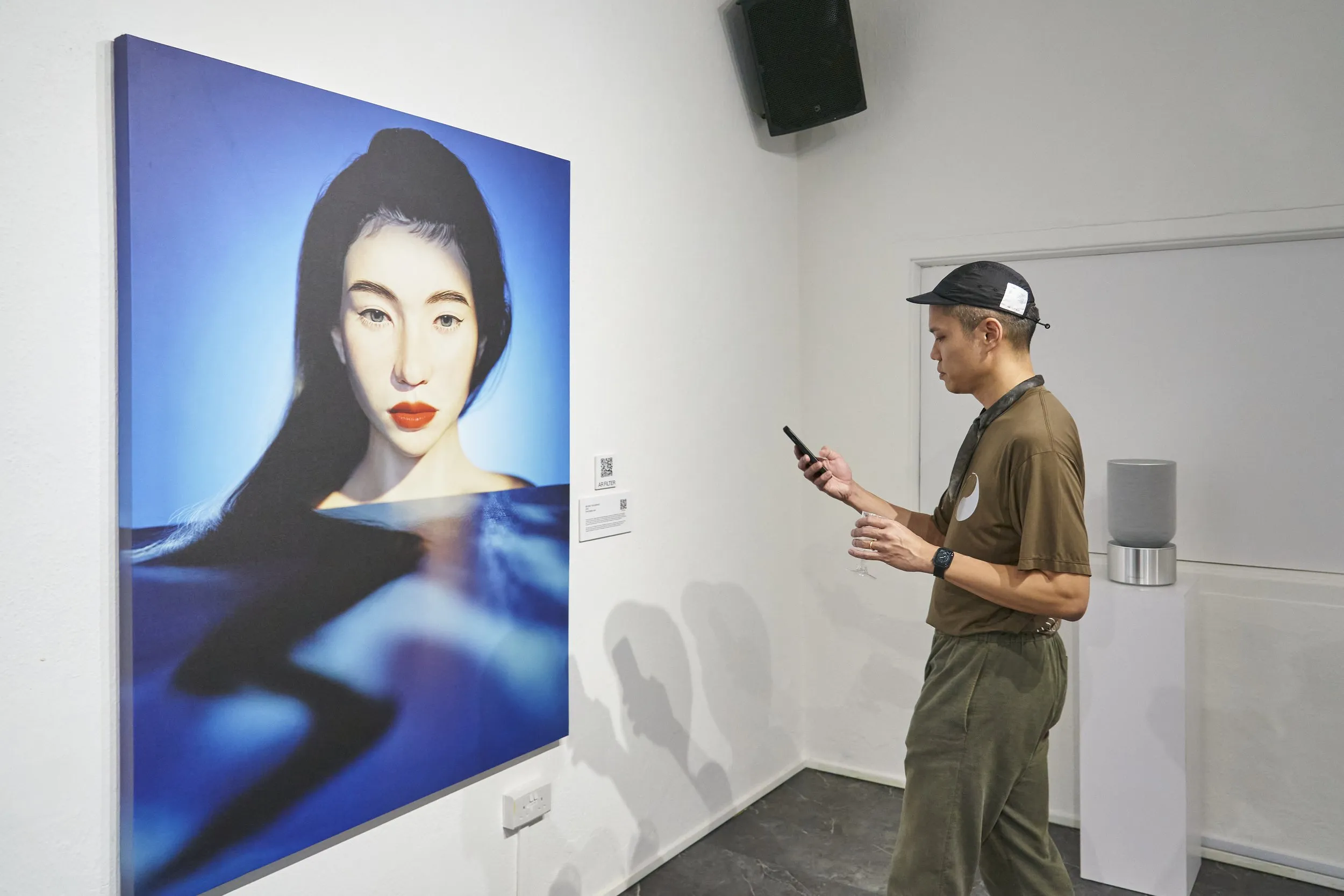Viewer using a phone to activate Beyond the Surface AR