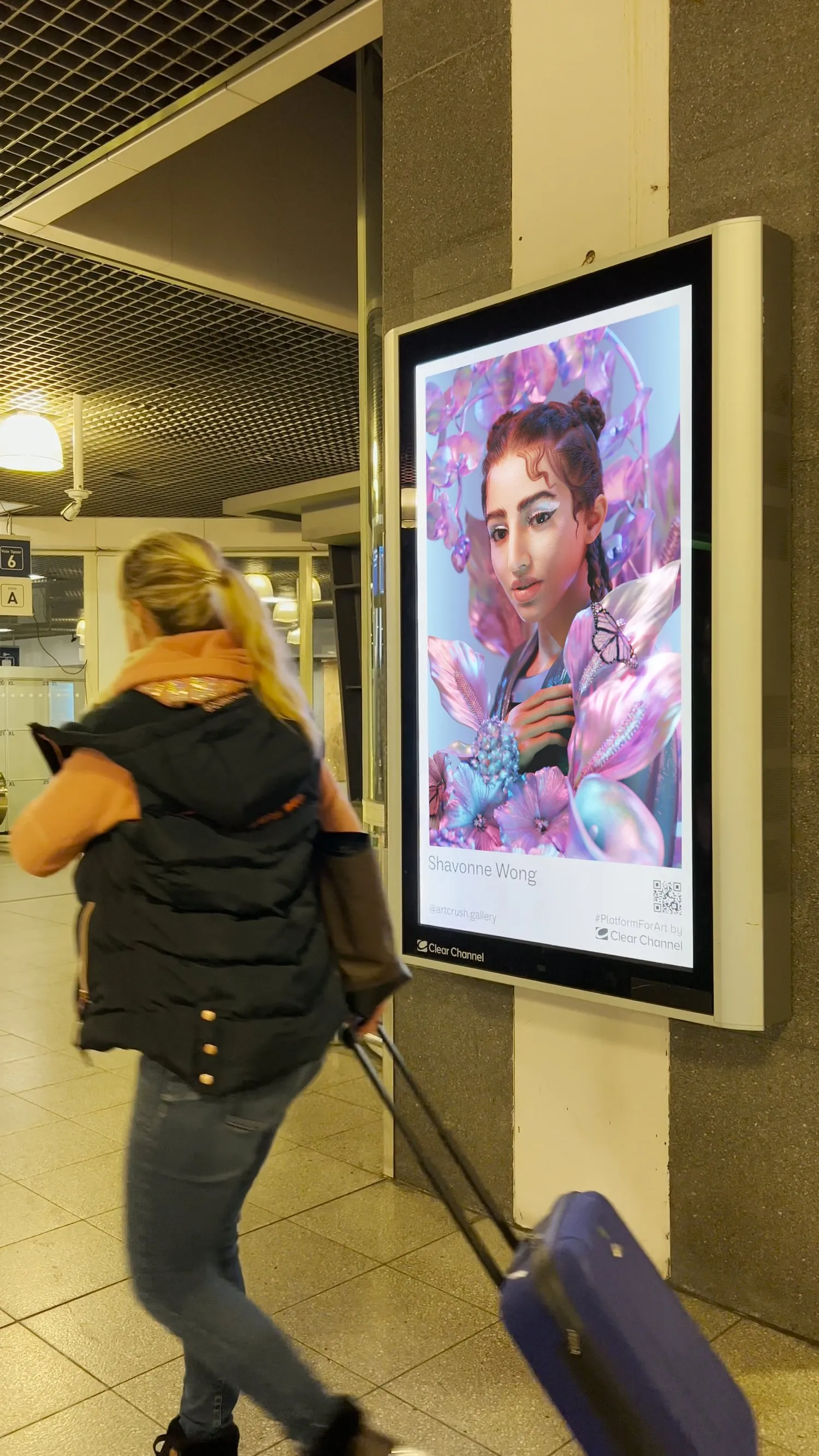 Framed display of Shavonne Wong's artwork in a transit or public exhibition setting.