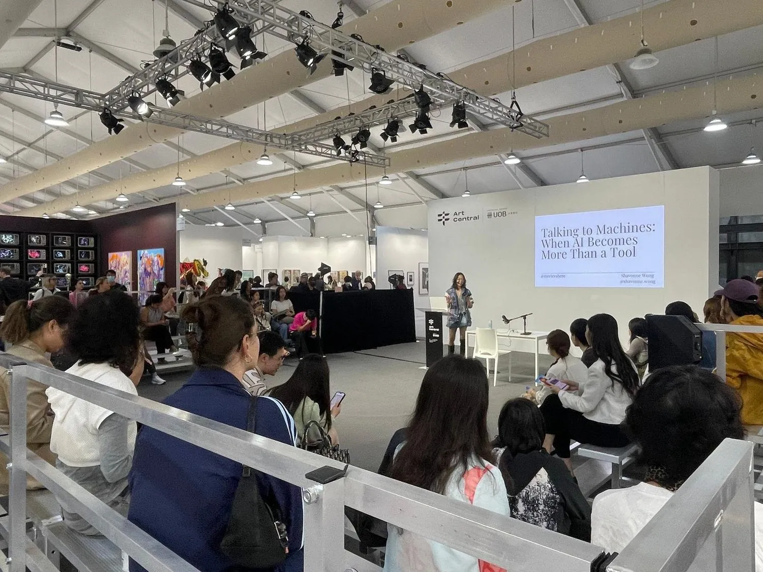 Shavonne Wong presenting Talking to Machines: When AI Becomes More Than a Tool at Art Central Hong Kong 2025, audience in attendance.