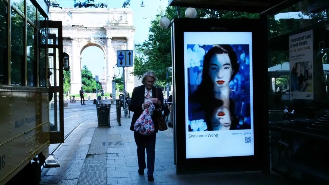 Shavonne Wong's digital portraiture shown at a Milan tram stop near the Arco della Pace.