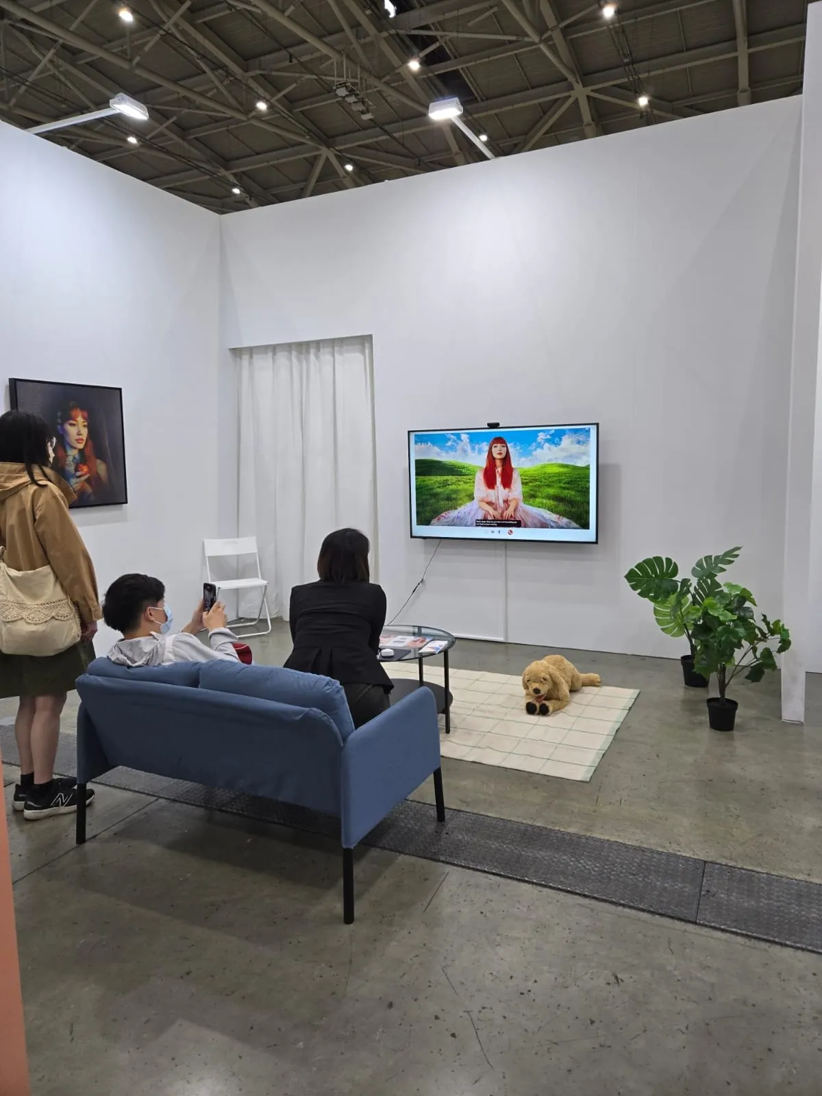 Installation view of Meet Eva Here at Taipei Dangdai 2025 with Eva displayed in a staged living room.