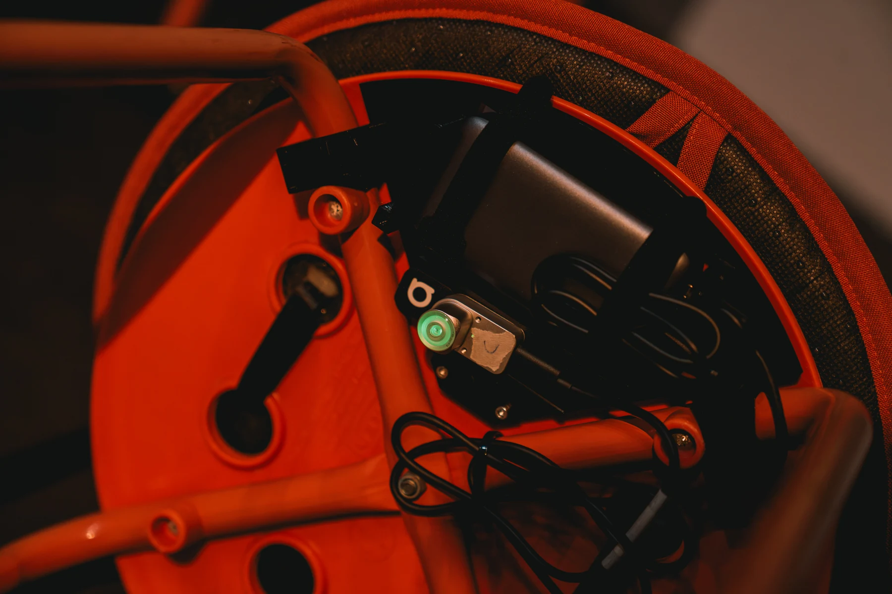 Close-up of the Antilatency tracker and its mount beneath a stool